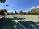 Well-maintained community tennis courts perfect for recreational play with green space around at 5550 W 80Th Pl # 20, Arvada, CO 80003
