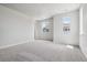 Spacious bedroom featuring plush neutral carpeting and an abundance of natural light at 14145 Deertrack Ln, Parker, CO 80134