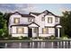 Striking new construction two-story home featuring black trimmed windows and a manicured front lawn at 14145 Deertrack Ln, Parker, CO 80134