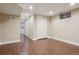 Spacious basement area featuring wood-look flooring, recessed lighting, and closet at 7650 W 24Th Ave, Lakewood, CO 80214