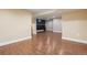 Large basement room featuring tile floors, recessed lighting, and an accent wall at 7650 W 24Th Ave, Lakewood, CO 80214