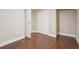 Cozy bedroom featuring wood-look flooring and a convenient closet for ample storage at 7650 W 24Th Ave, Lakewood, CO 80214