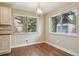 Bright dining area featuring hardwood floors, two windows and modern light fixture at 7650 W 24Th Ave, Lakewood, CO 80214
