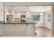 Kitchen with granite countertops, stainless steel appliances, and an adjacent eat-in area at 7650 W 24Th Ave, Lakewood, CO 80214