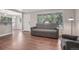 Well-lit living room featuring hardwood floors, large windows, and an open layout at 7650 W 24Th Ave, Lakewood, CO 80214