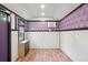 Bright and airy office showcasing custom damask wallpaper, hard wood floors and window for natural light, blending elegance at 7650 W 24Th Ave, Lakewood, CO 80214