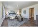 Spacious bedroom featuring a sitting area and ensuite bath, decorated with neutral tones at 4204 Sandstone Dr, Mead, CO 80504