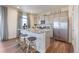 Modern kitchen with stainless steel appliances, granite countertops, and a breakfast bar at 4204 Sandstone Dr, Mead, CO 80504