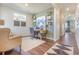 Bright home office featuring custom shelving, modern décor, and comfortable seating at 4204 Sandstone Dr, Mead, CO 80504