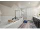 Bright bathroom featuring a soaking tub, glass shower, and double sink vanity at 1867 W 137Th Ln, Broomfield, CO 80023
