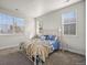 Cozy bedroom with a full-size bed and lots of natural light at 1867 W 137Th Ln, Broomfield, CO 80023