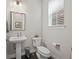 Bright half bath with modern sink, mirror, and decor at 1867 W 137Th Ln, Broomfield, CO 80023