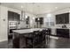 Modern kitchen with large island, stainless steel appliances, and dark cabinetry at 1867 W 137Th Ln, Broomfield, CO 80023