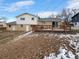Elevated backyard with a wooden deck and a view of the surrounding neighborhood at 10547 Pompey Way, Northglenn, CO 80234