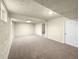 Finished basement offering ample space with neutral carpeting at 10547 Pompey Way, Northglenn, CO 80234