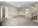Bright, open basement featuring neutral walls and carpeting at 10547 Pompey Way, Northglenn, CO 80234