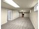 Large finished basement with neutral walls and carpet, plus stairs to upper level at 10547 Pompey Way, Northglenn, CO 80234