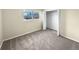 Well-lit bedroom with neutral walls, carpet, and a large closet at 10547 Pompey Way, Northglenn, CO 80234