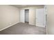 Simple bedroom with neutral carpeting and a large closet at 10547 Pompey Way, Northglenn, CO 80234