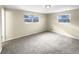 Spacious bedroom with neutral decor and large windows at 10547 Pompey Way, Northglenn, CO 80234