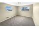 Bright bedroom with neutral walls, carpet, and ample window light at 10547 Pompey Way, Northglenn, CO 80234