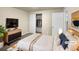 Virtually staged bedroom with ample closet space and modern dresser at 10547 Pompey Way, Northglenn, CO 80234