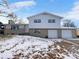Ranch style home with attached two-car garage and snowy front yard at 10547 Pompey Way, Northglenn, CO 80234
