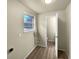 Laundry room with linoleum flooring, a window, and hookups for washer/dryer at 10547 Pompey Way, Northglenn, CO 80234
