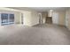 Open concept living and dining area with sliding glass doors leading to the patio at 10547 Pompey Way, Northglenn, CO 80234