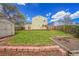 Backyard with green grass, deck, shed, and garden area at 10704 Moore St, Broomfield, CO 80021