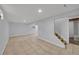 Finished basement featuring tile flooring and stairs at 10704 Moore St, Broomfield, CO 80021