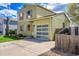 Charming two-story home featuring a well-maintained lawn, clear garage door, and inviting curb appeal at 10704 Moore St, Broomfield, CO 80021