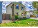 Charming two-story home featuring a well-maintained lawn, clear garage door, and inviting curb appeal at 10704 Moore St, Broomfield, CO 80021