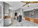 Open concept kitchen featuring stainless steel appliances, butcher block countertops, and adjoining living area at 10704 Moore St, Broomfield, CO 80021