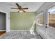 Bright kitchen with marble floors, stainless steel appliances, and a ceiling fan with natural light at 10704 Moore St, Broomfield, CO 80021