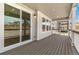 Covered porch area featuring sliding glass doors and wood flooring at 4331 Soapberry Pl, Castle Rock, CO 80108