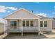 Exterior shot showing a home's back porch, multiple windows, and deck area at 4331 Soapberry Pl, Castle Rock, CO 80108