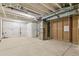 Unfinished basement with exposed ceiling beams and concrete flooring, ready for customization at 4331 Soapberry Pl, Castle Rock, CO 80108