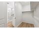 Open bathroom and closet configuration featuring a glass shower and built-in closet shelving at 4331 Soapberry Pl, Castle Rock, CO 80108