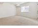 Bright bedroom with a window offering natural light and neutral carpeting at 4331 Soapberry Pl, Castle Rock, CO 80108
