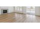 Bright living room featuring wood flooring, a modern fireplace and access to the outdoor deck at 4331 Soapberry Pl, Castle Rock, CO 80108