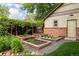Exterior showcasing the raised garden beds and access to the backyard, perfect for gardening enthusiasts at 4224 N Clay St, Denver, CO 80211