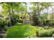 Expansive backyard featuring lush lawn and mature trees at 4224 N Clay St, Denver, CO 80211