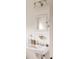 Bathroom with a pedestal sink, medicine cabinet, and classic fixtures and lighting at 4224 N Clay St, Denver, CO 80211