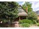 Charming home featuring a brick facade, lush landscaping, and a welcoming front porch at 4224 N Clay St, Denver, CO 80211