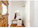 Inviting foyer features stylish bench seating, decorative accents, and hardwood floors at 4224 N Clay St, Denver, CO 80211