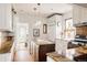 Kitchen with granite counters, island, stainless steel appliances, and stained-glass window feature at 4224 N Clay St, Denver, CO 80211