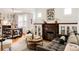 Inviting living room with hardwood floors, fireplace, and natural light at 4224 N Clay St, Denver, CO 80211
