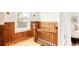 View of the staircase with hardwood floors and wood paneling at 4224 N Clay St, Denver, CO 80211