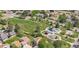 Charming neighborhood aerial view showcasing a lush green park with a playground and a gazebo at 16149 E Rice Pl # A, Aurora, CO 80015